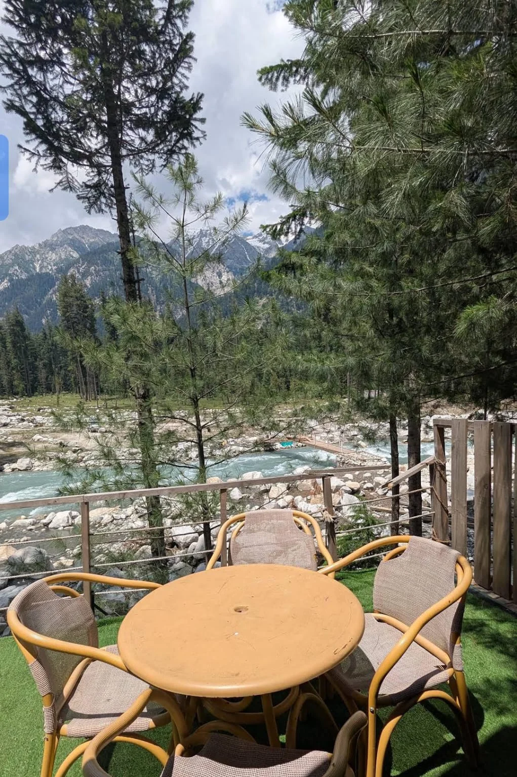 A terrace table overlooking the river and mountains